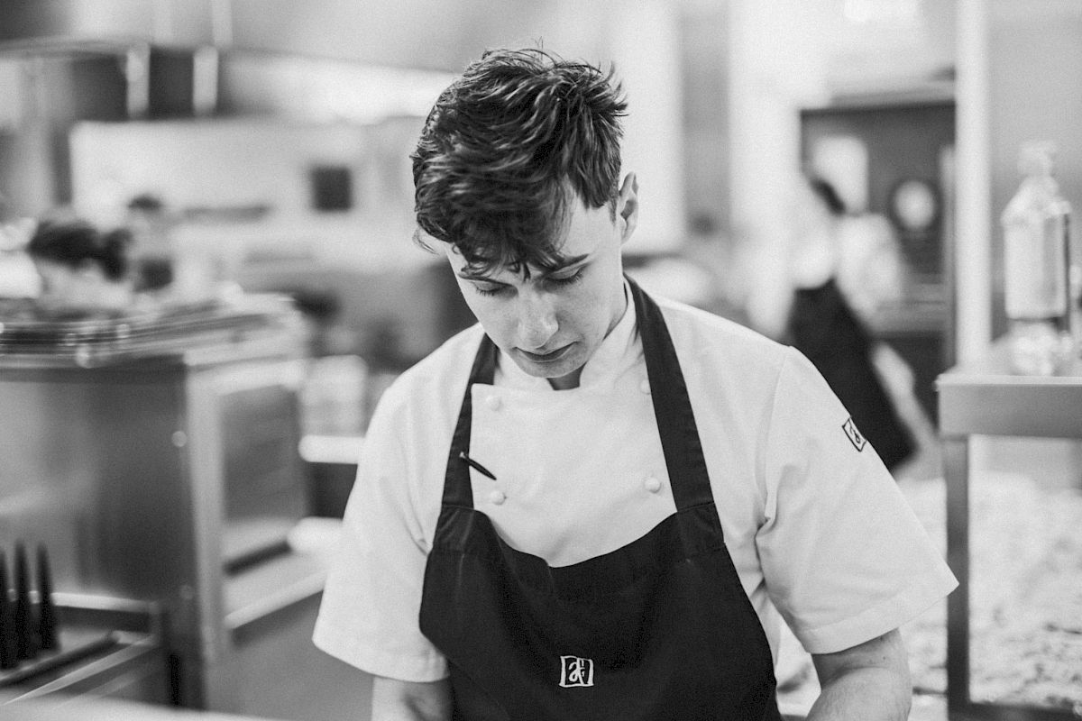 Andrew Fairlie chefs having a discussion in the kitchen